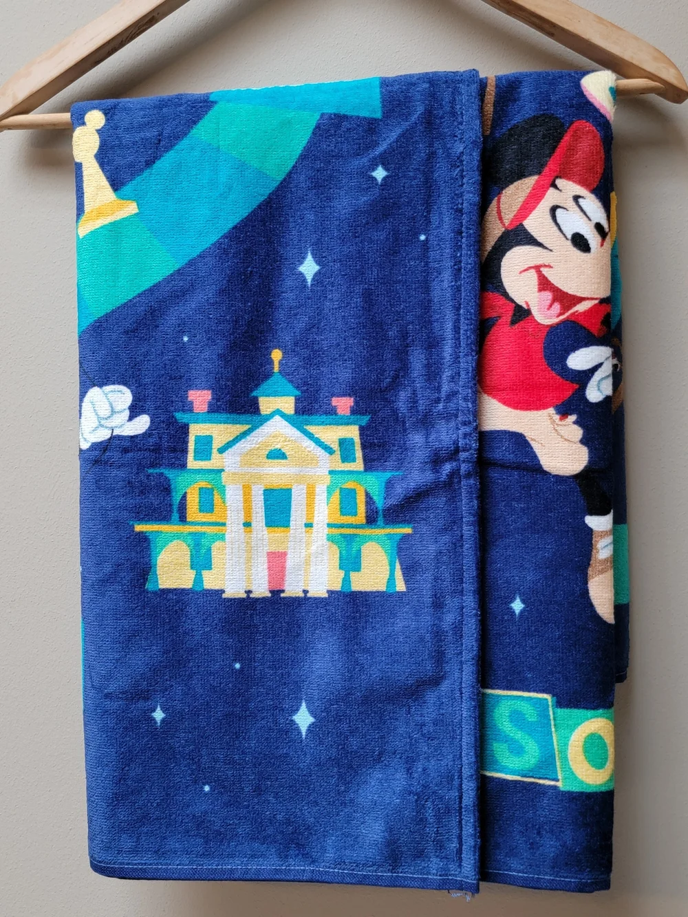 Disney Parks Beach Towel Navy Blue with Teal, Yellow & Pink Character Design
